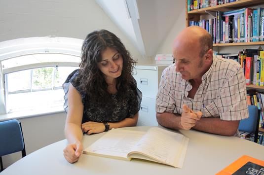 Student and Teacher in Library